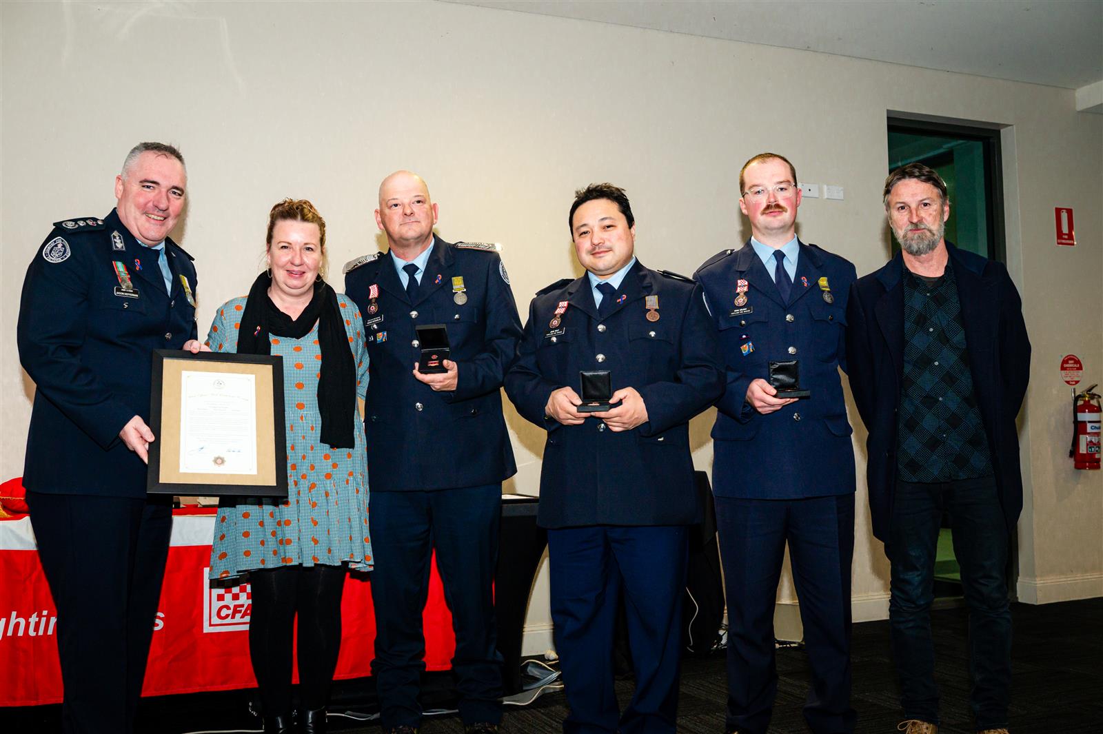 Chief Officer Jason Heffernan and Unit Citation for Courage recipients with Katie Robins and Justin Mallen (Garry Mallen's children)